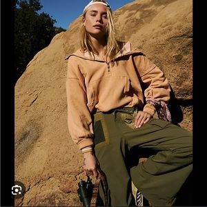 NWT free people movement shelter hoodie in peach/orange. Size L. NEW WITH TAGS